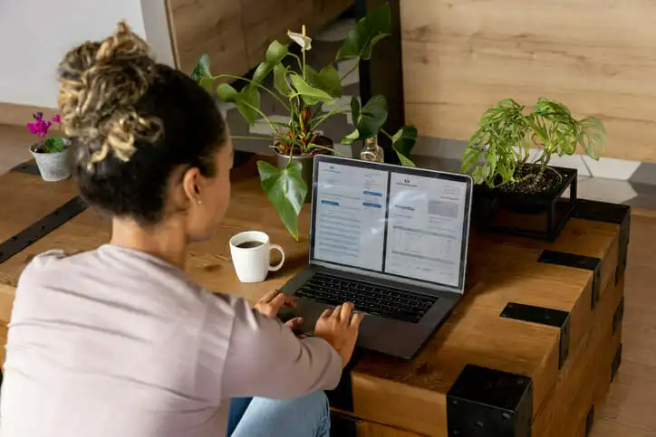 A woman reviewing her checking account online.