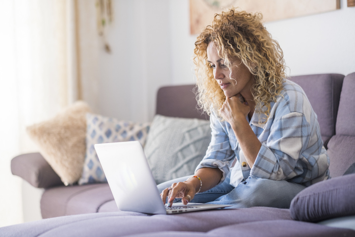 A woman reviews her investment portfolio.