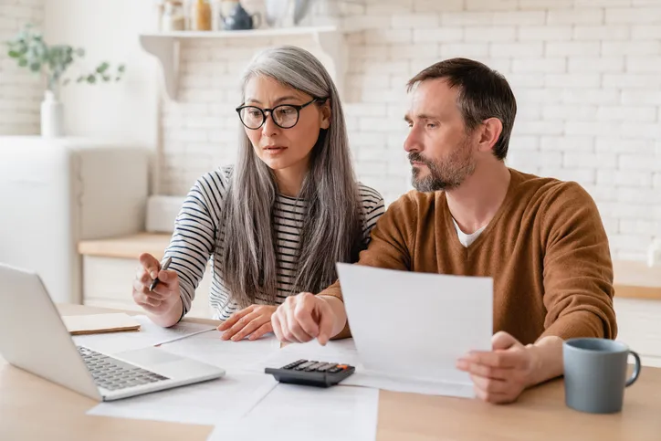A couple researching how alienation clauses are used in a mortgage.